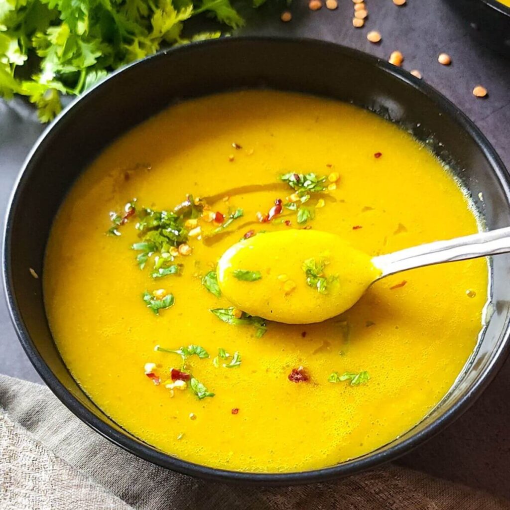 a bowl of soup with a spoon